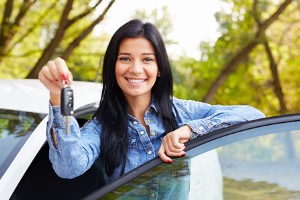 Girl standing outside of car